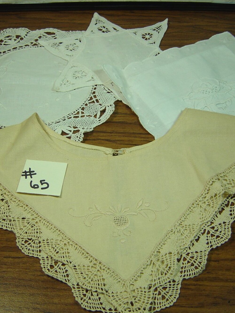 3 white embroidered doilies & 1 beige embroidered collar
